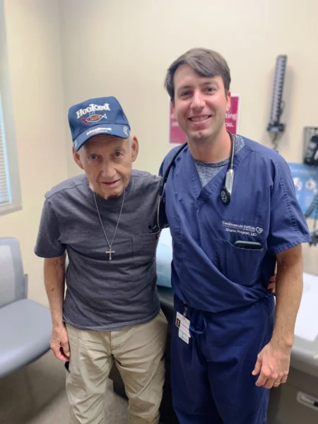 Dr. Shane Prejean, cardiologist in Houma, poses with a patient