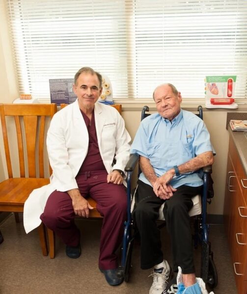 A doctor and a patient sitting together in an exam room