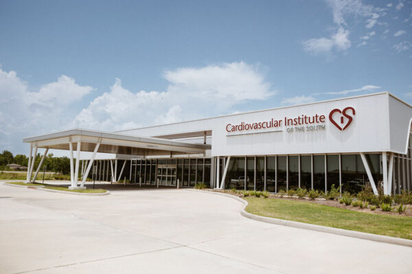Modern Cardiovascular Institute of the South specializing in heart health under a clear sky.