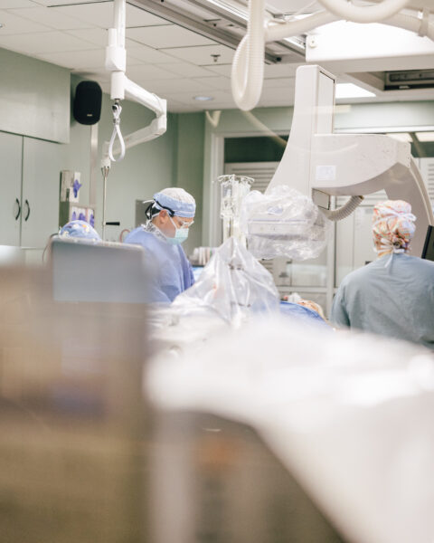 CIS staff members preforming a procedure on a patient with heart failure in an operating room