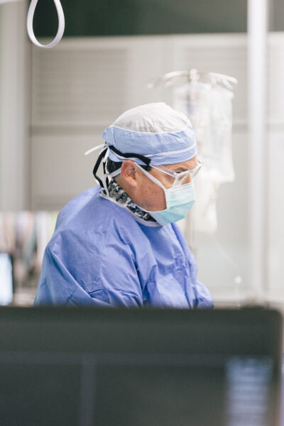 A doctor concentrates during a cardiovascular surgery