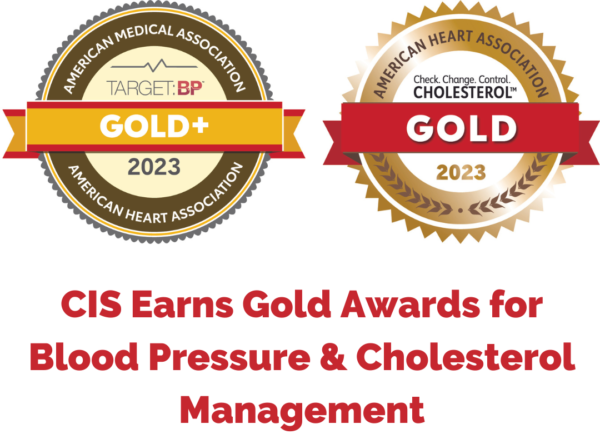Two gold award seals showcasing recognition for excellence in blood pressure and cholesterol management by the Cardiovascular Institute of the South for the year 2023, awarded by the American Medical Association and the American Heart Association