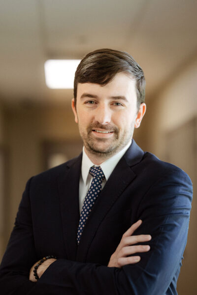 Headshot of Trey Larose, JD, MBA, In-House Legal Counsel at CIS