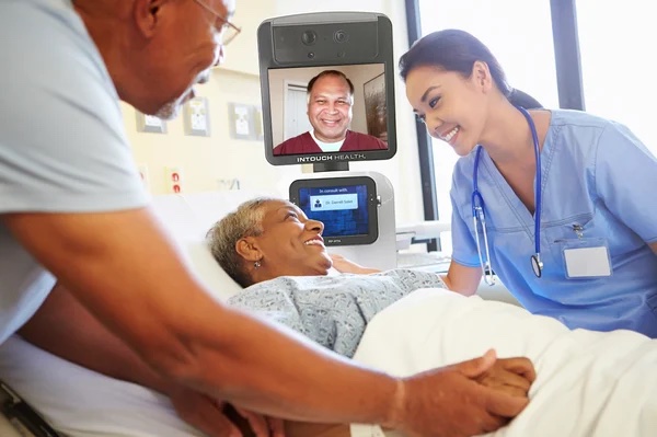 A smiling patient and nurse during a telehealth appointment