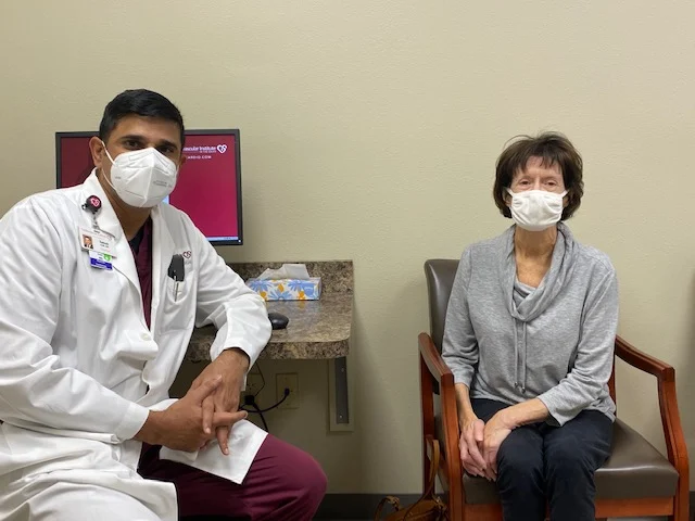 A cardiologist and a patient wearing face masks during a consultation at the Cardiovascular Institute of the South.