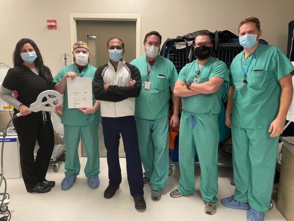 A group of CIS staff members pose with the CardioMEMS™ HF System at Baton Rouge General