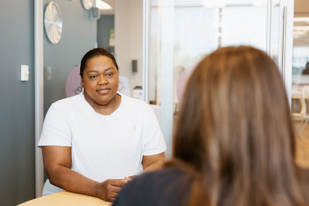 African American female patient consulting with cardiovascular specialists in healthcare setting.