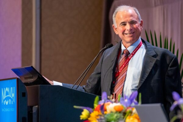 Dr. Craig Walker delivers a presentation with a smile at the New Cardiovascular Horizons conference in New Orleans.