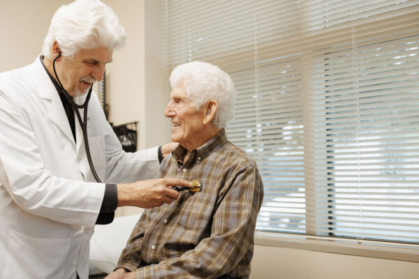 A senior man smiles during a consultation with a doctor for cardiac ablation in Louisiana