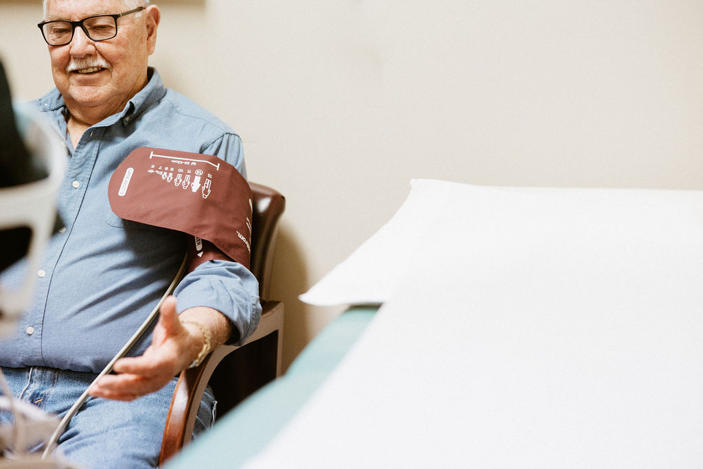 Older man getting blood pressure checked